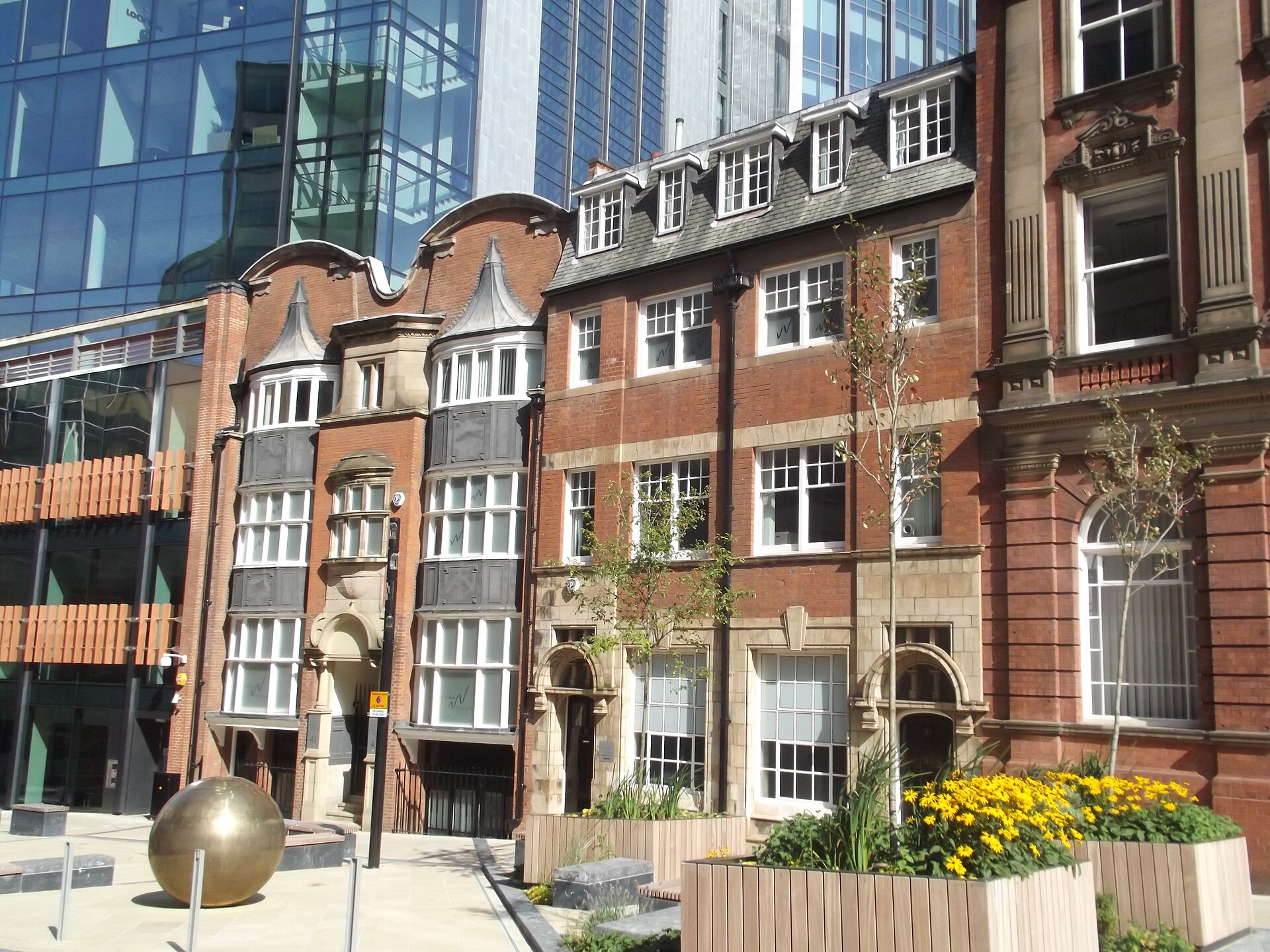 Modern financial district office building exterior in London, featuring glass facades and contemporary design.