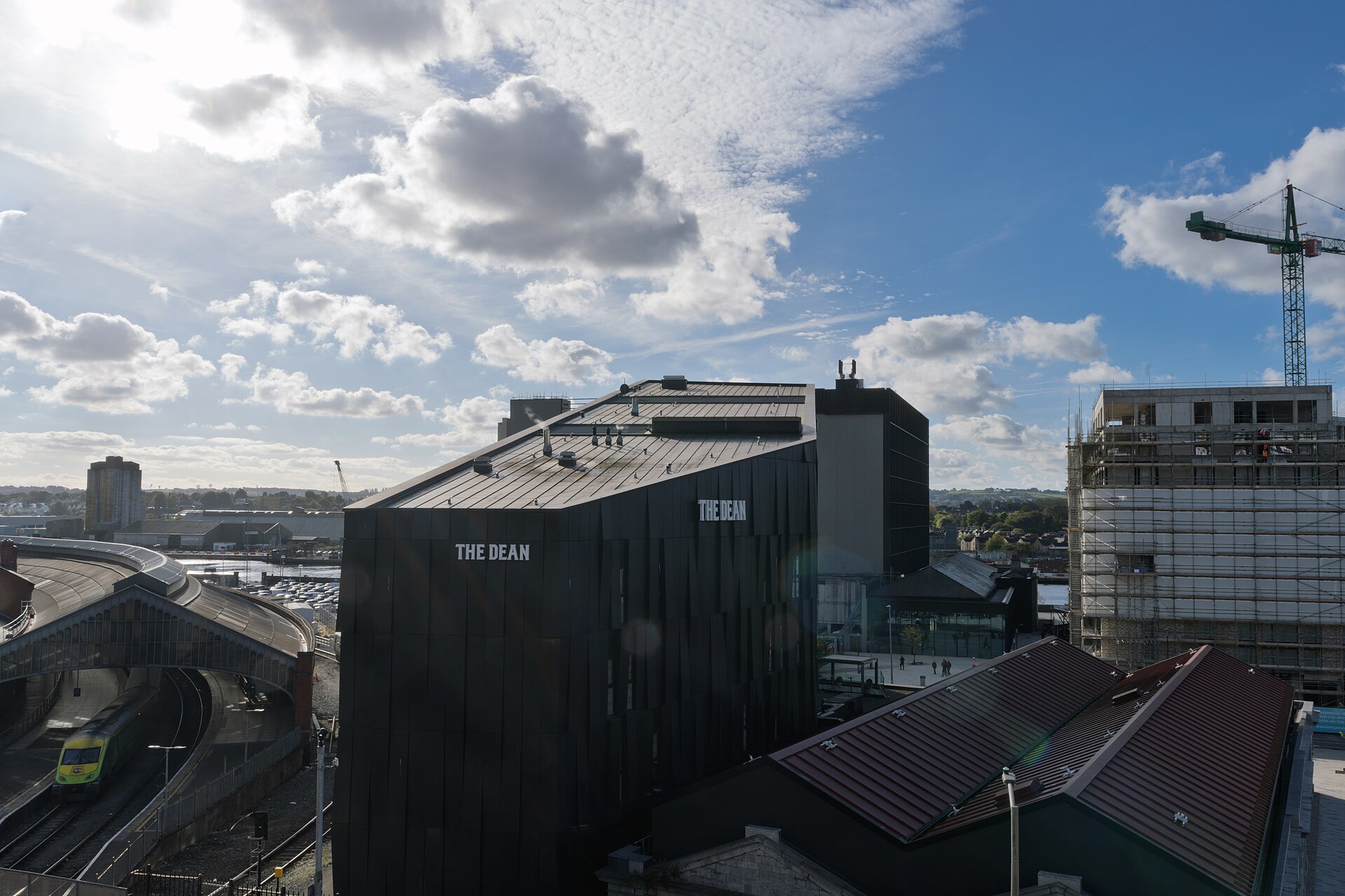 Split image showing a modern corporate building and an elegant residential property.