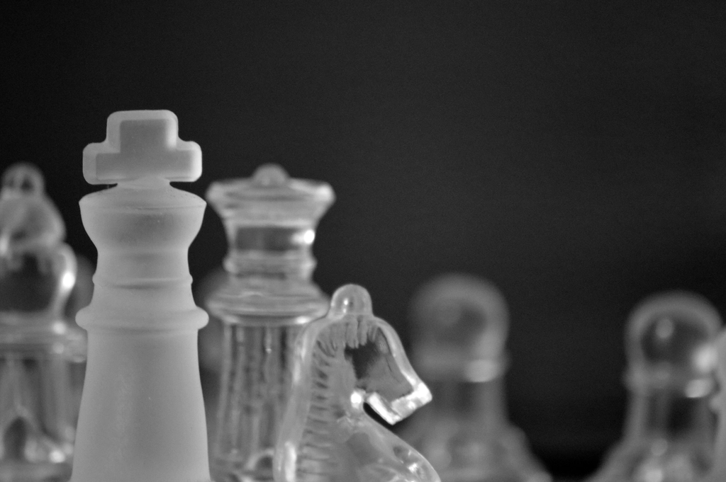 A close-up of a strategic chess game in progress, representing planning and mitigation.