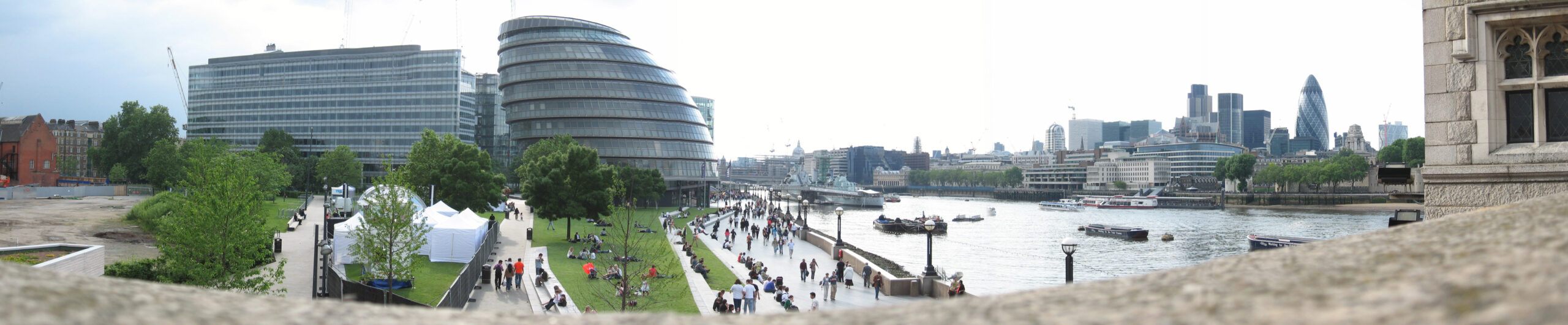 A panoramic view of the London financial district skyline at dusk, with modern skyscrapers representing investment and capital markets.