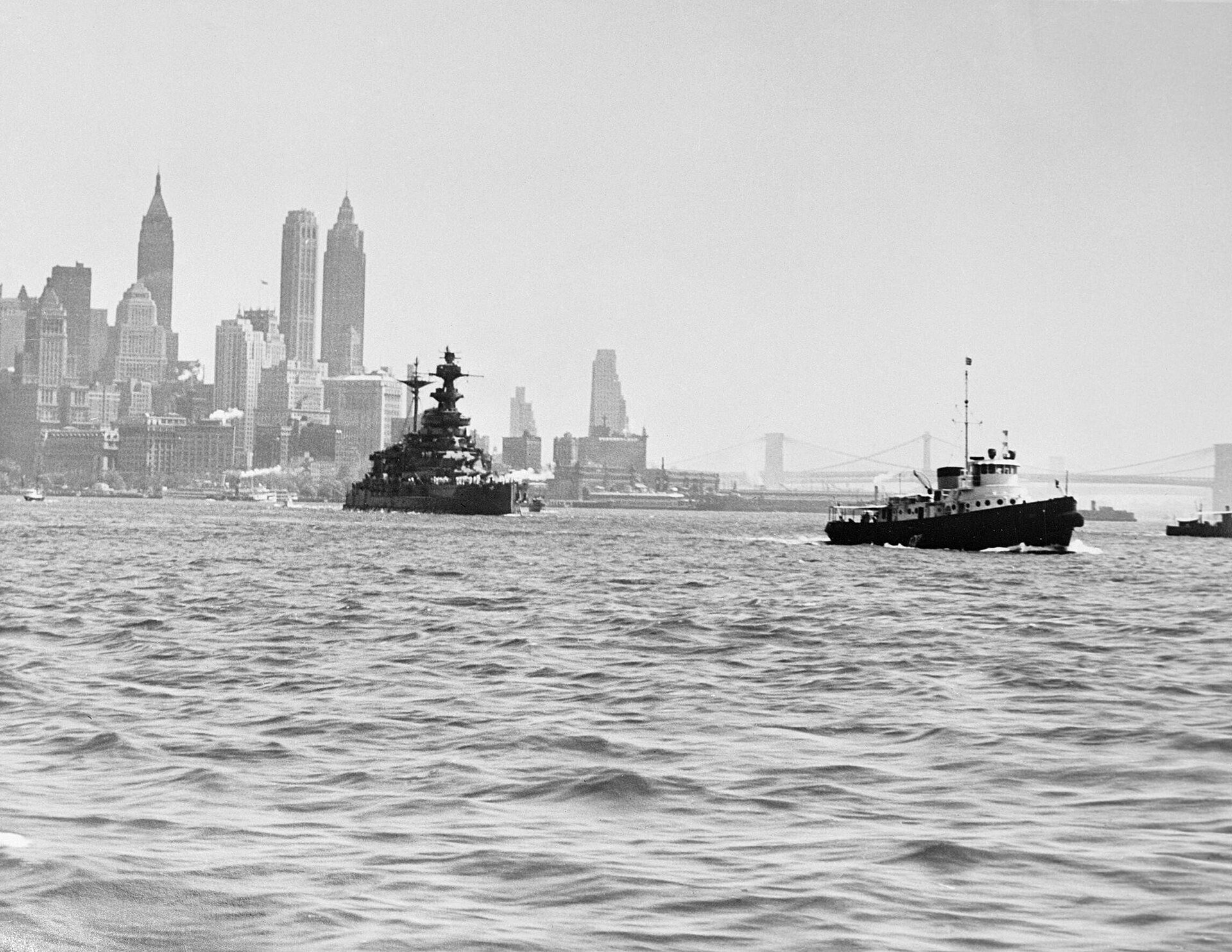 A split image or composite showing a distinct contrast between a dense, modern city skyline and a smaller, more historic UK city skyline.