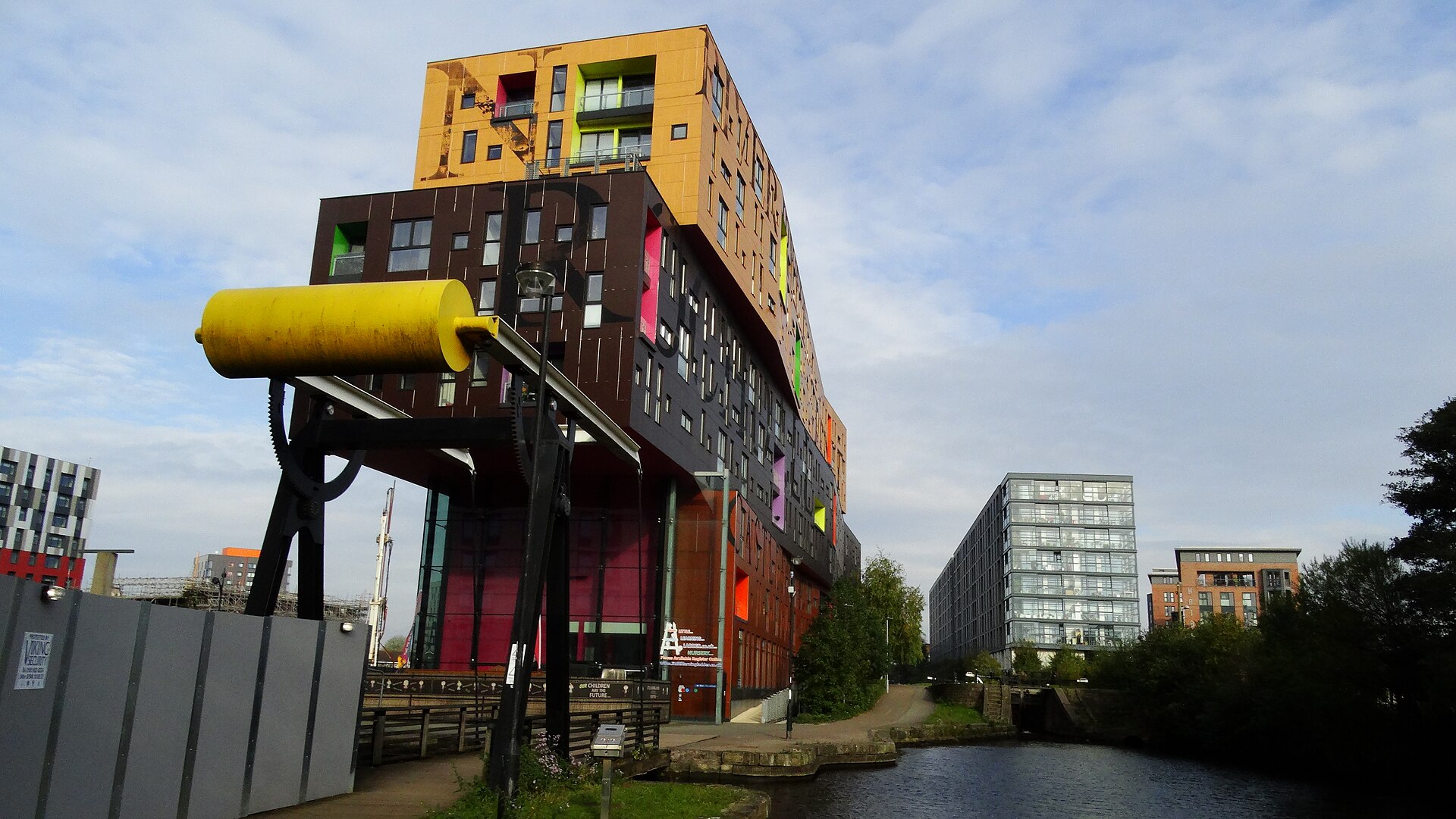 Modern apartment buildings and restored warehouses in Manchester's Ancoats district