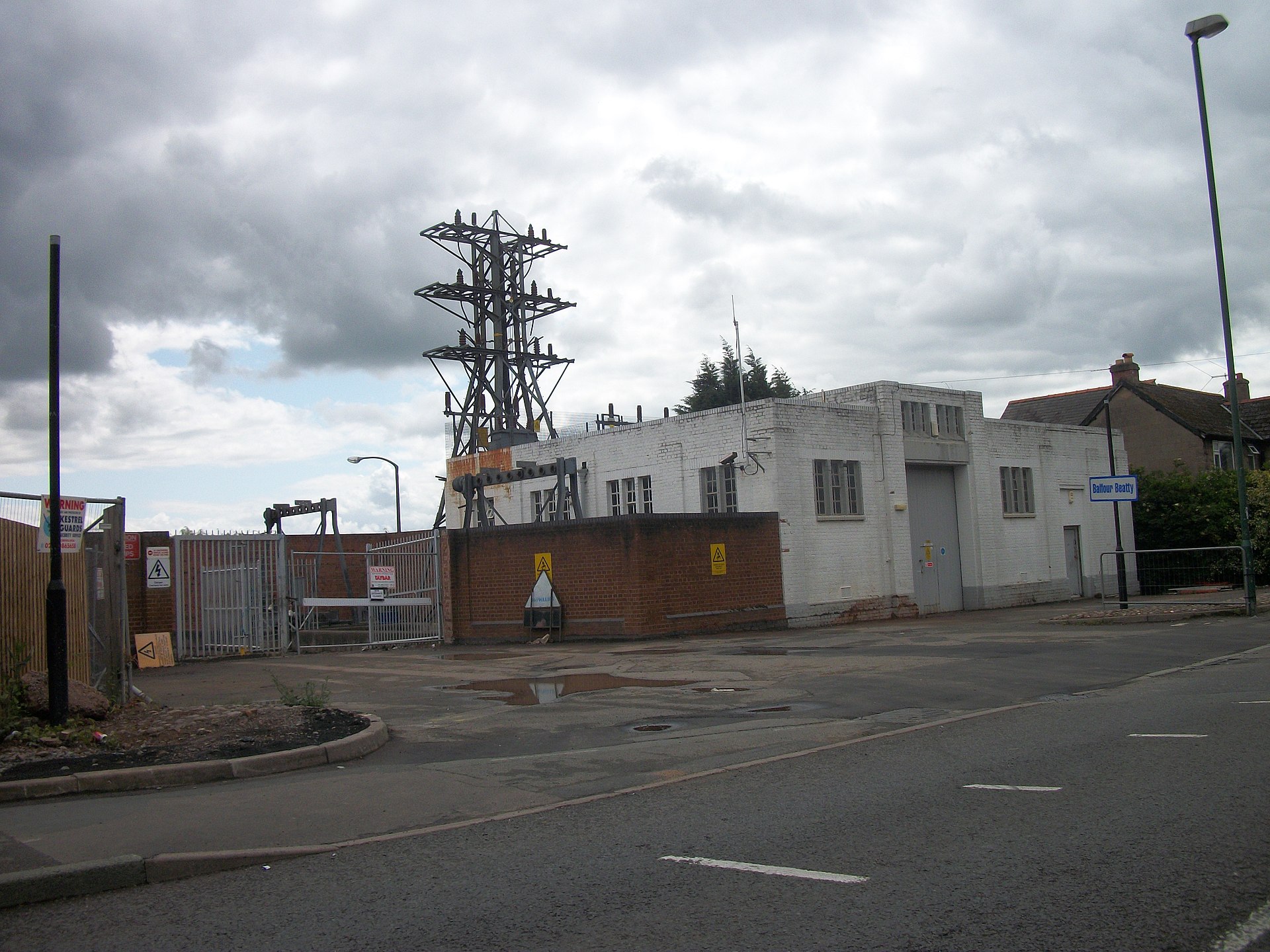 Electricity substation and transmission equipment beside an industrial site