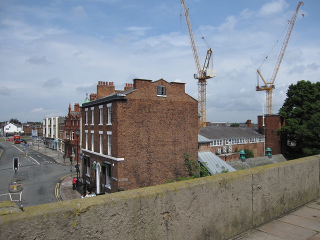 Construction cranes above new urban property development