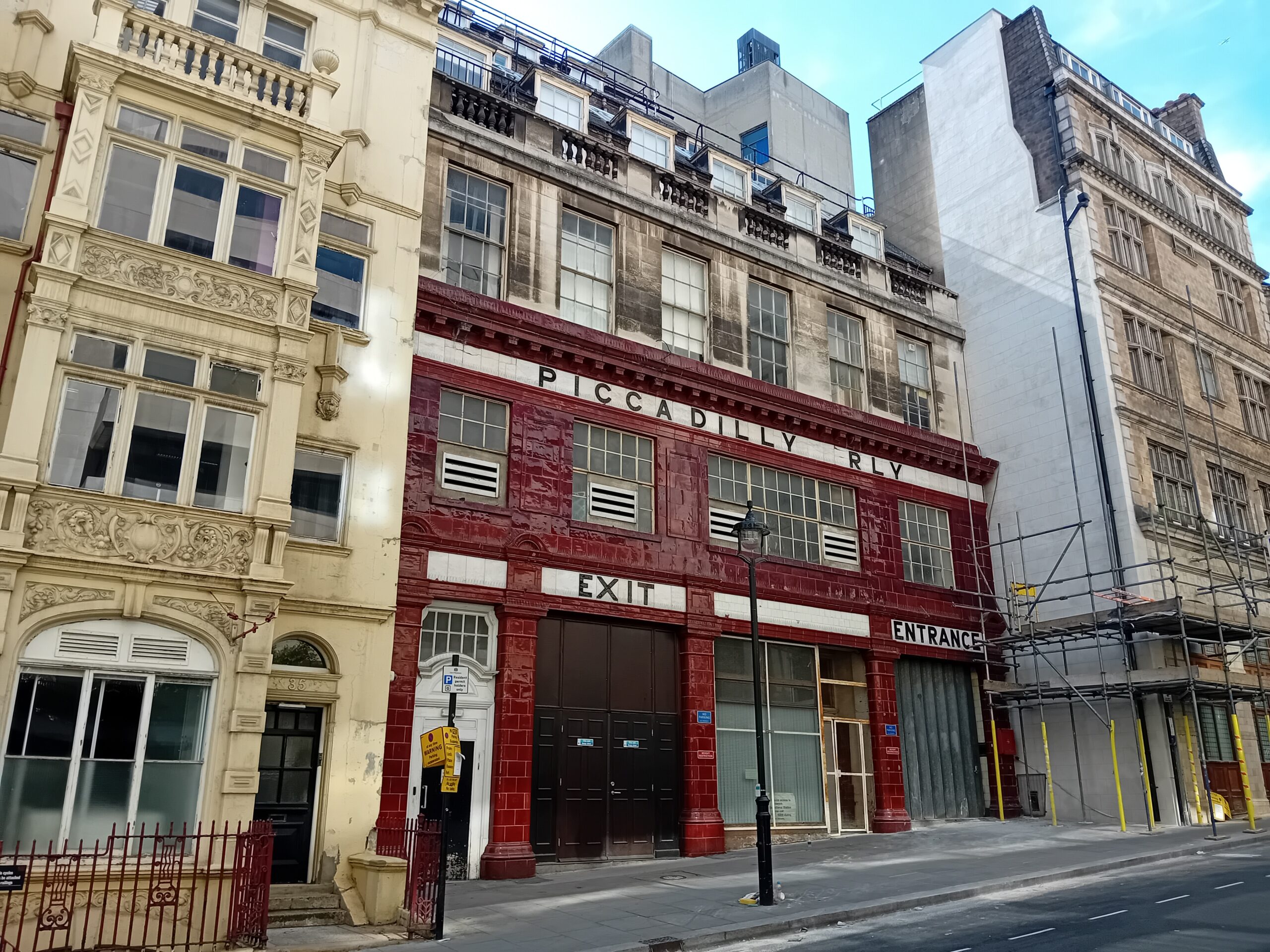 Office workers walking past commercial buildings in central London