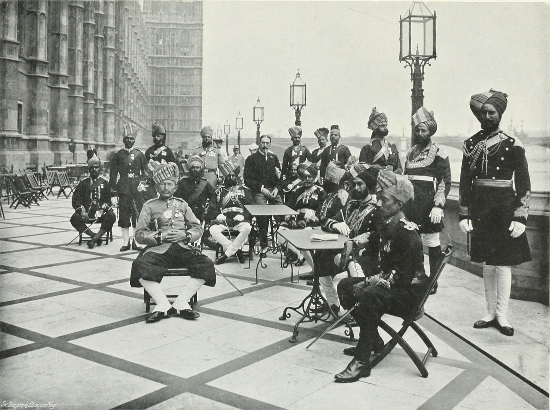 Office workers on a landscaped rooftop terrace overlooking London