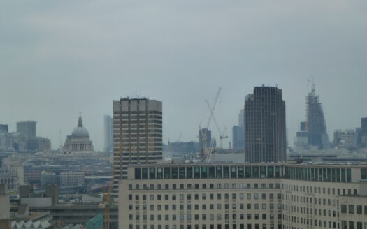 London skyline beside the River Thames at dusk