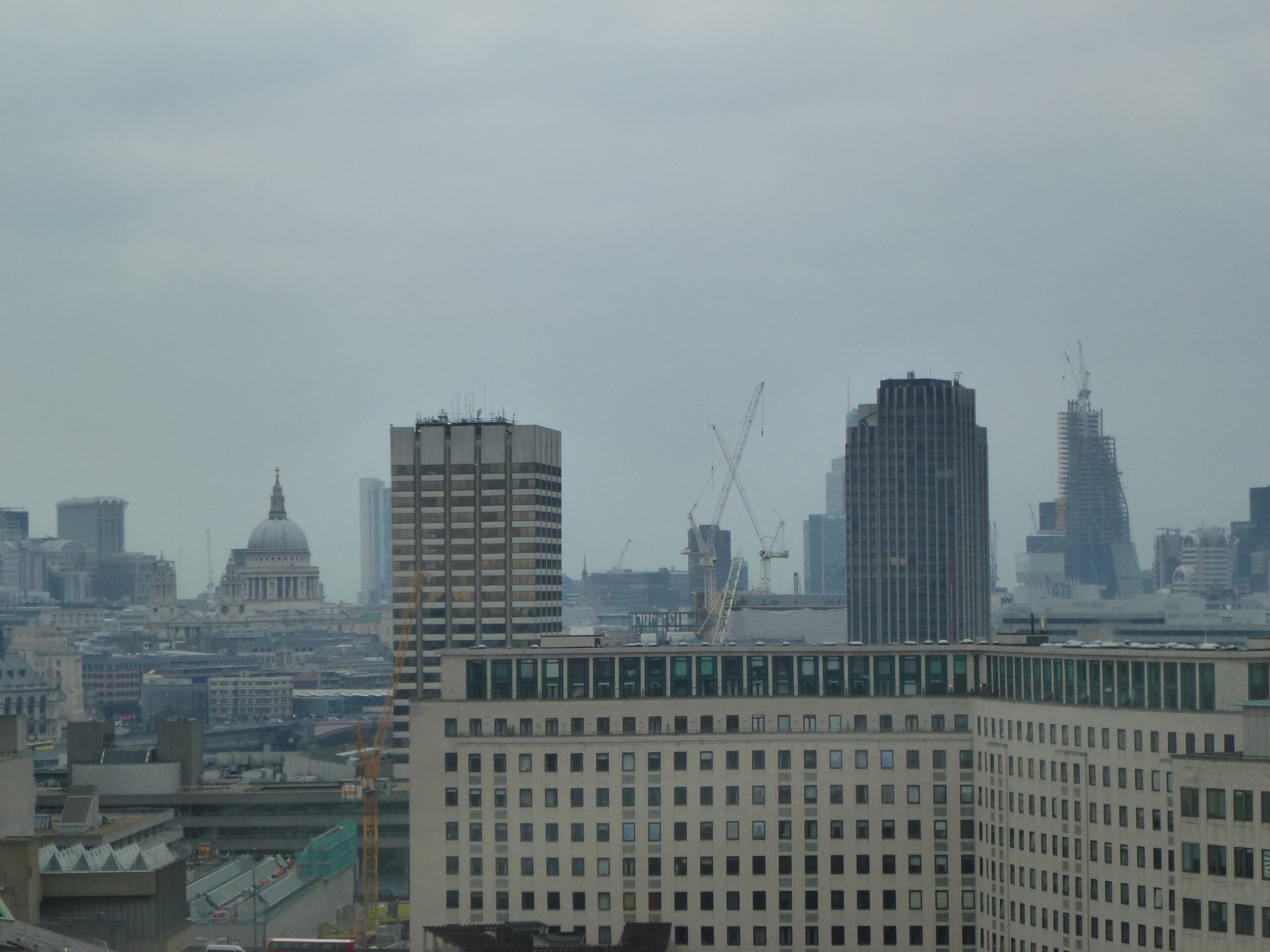 London skyline beside the River Thames at dusk