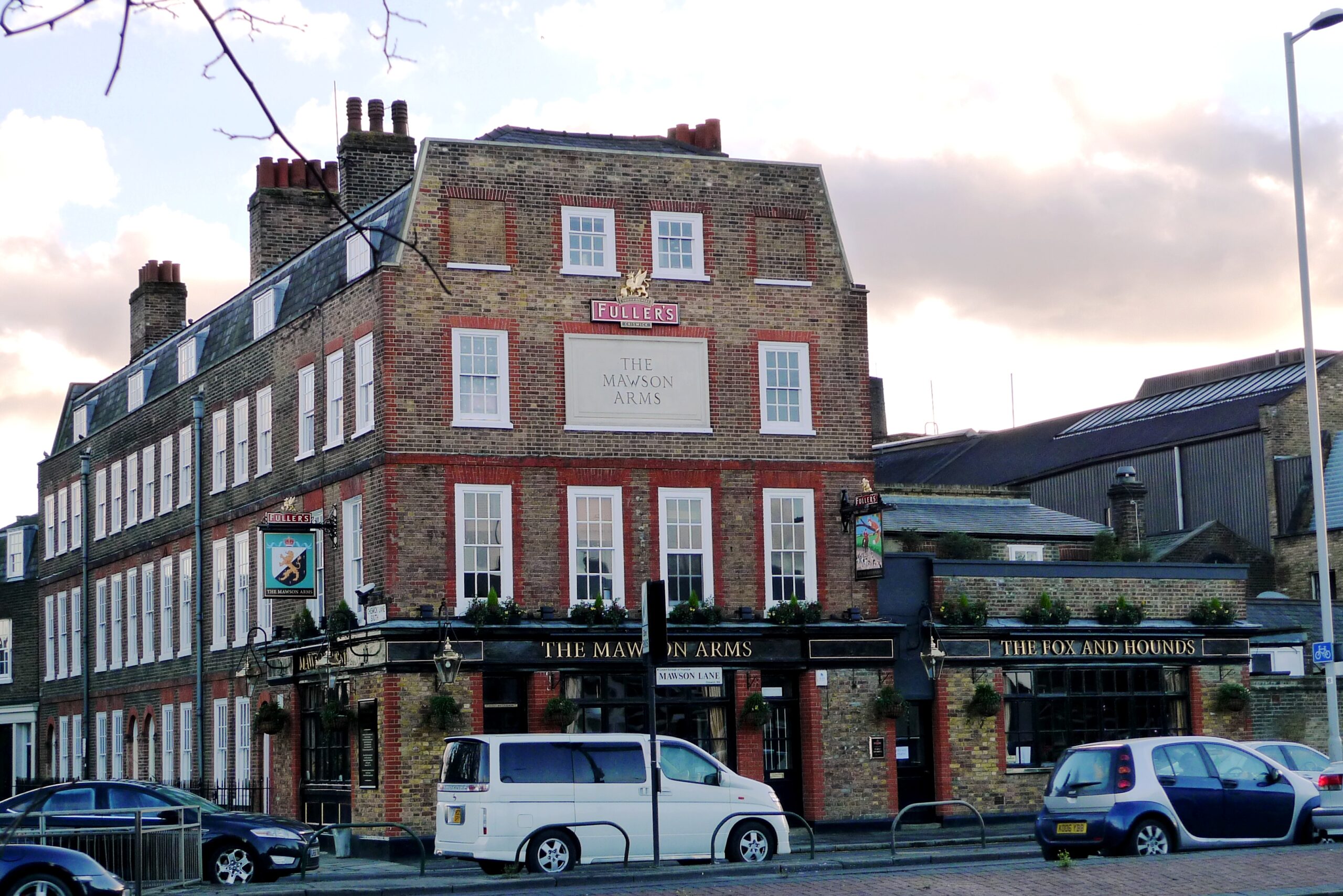 Older central London office building beside a recently refurbished workplace