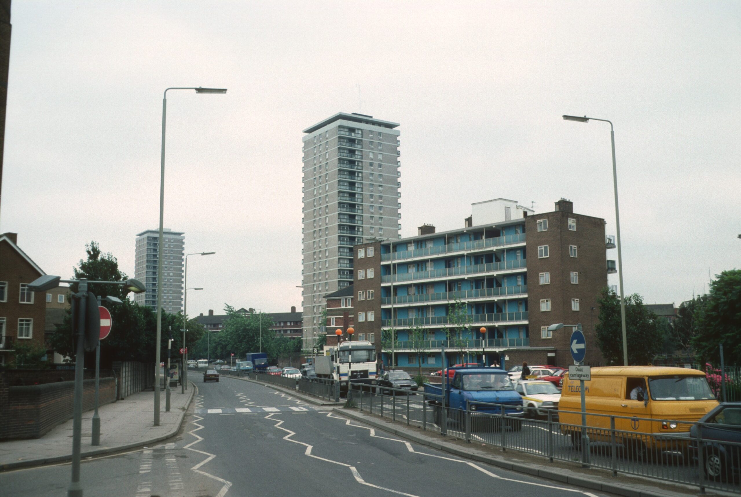Prospective tenants attending a viewing outside a London apartment building