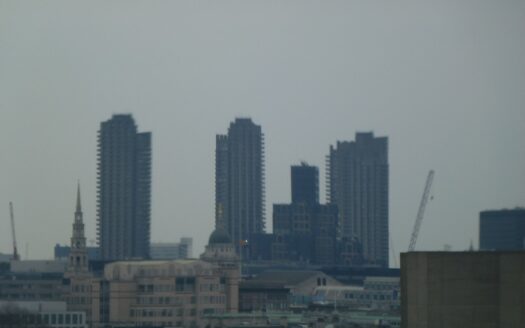 Manchester city centre skyline with modern apartment towers at dusk