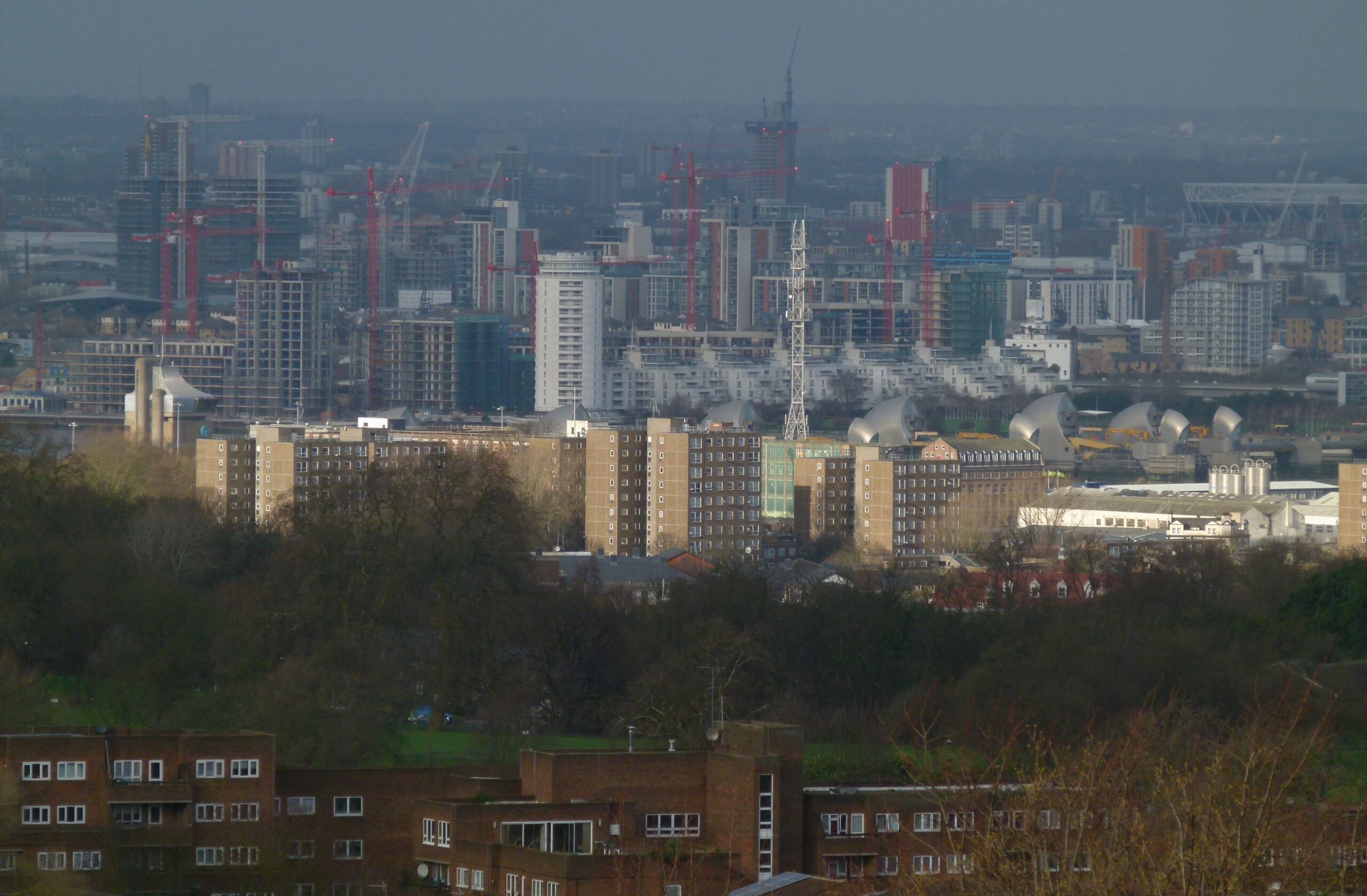 Residential towers under construction with cranes on a London development site