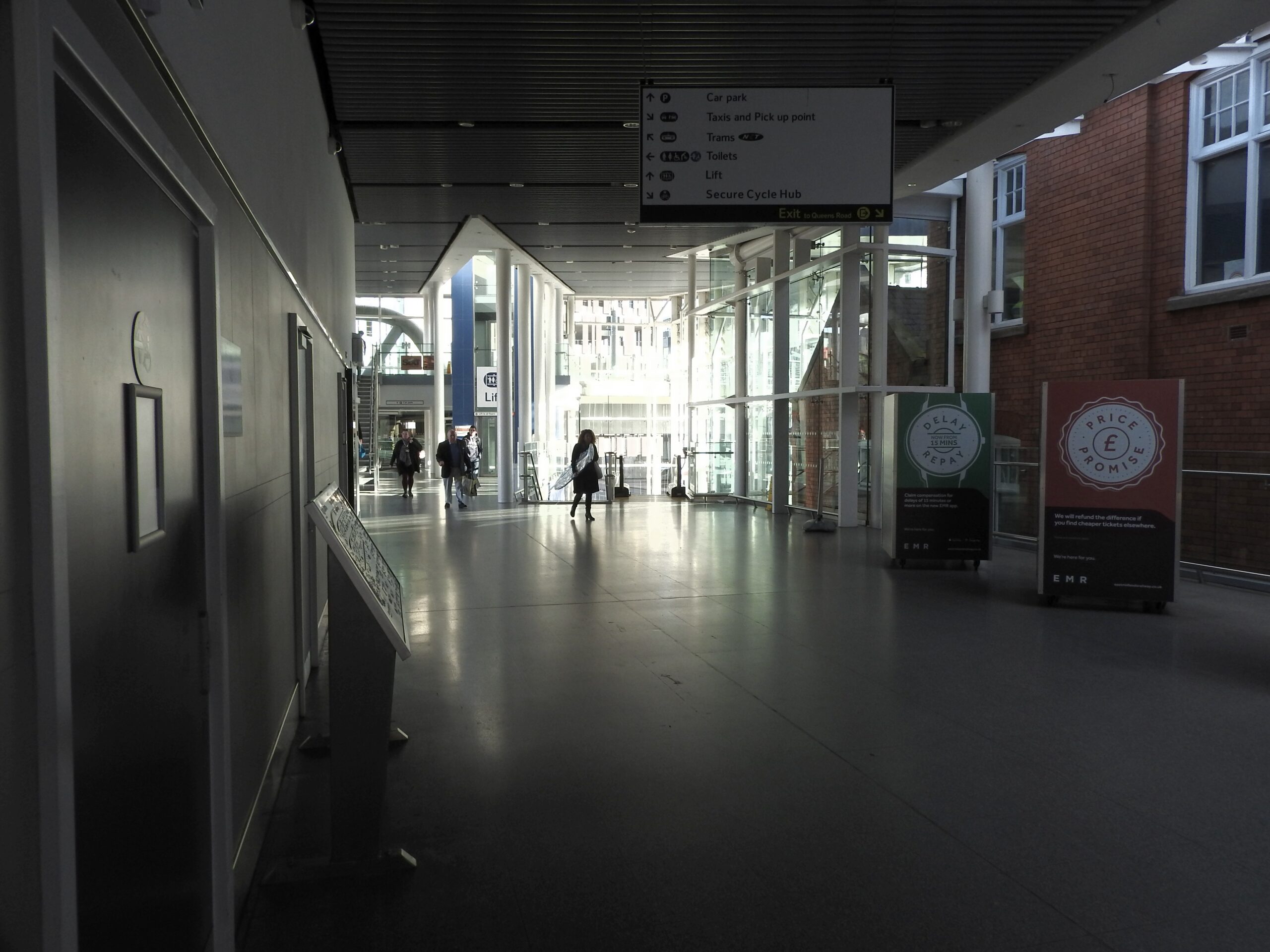 Nottingham railway station exterior with arriving passengers